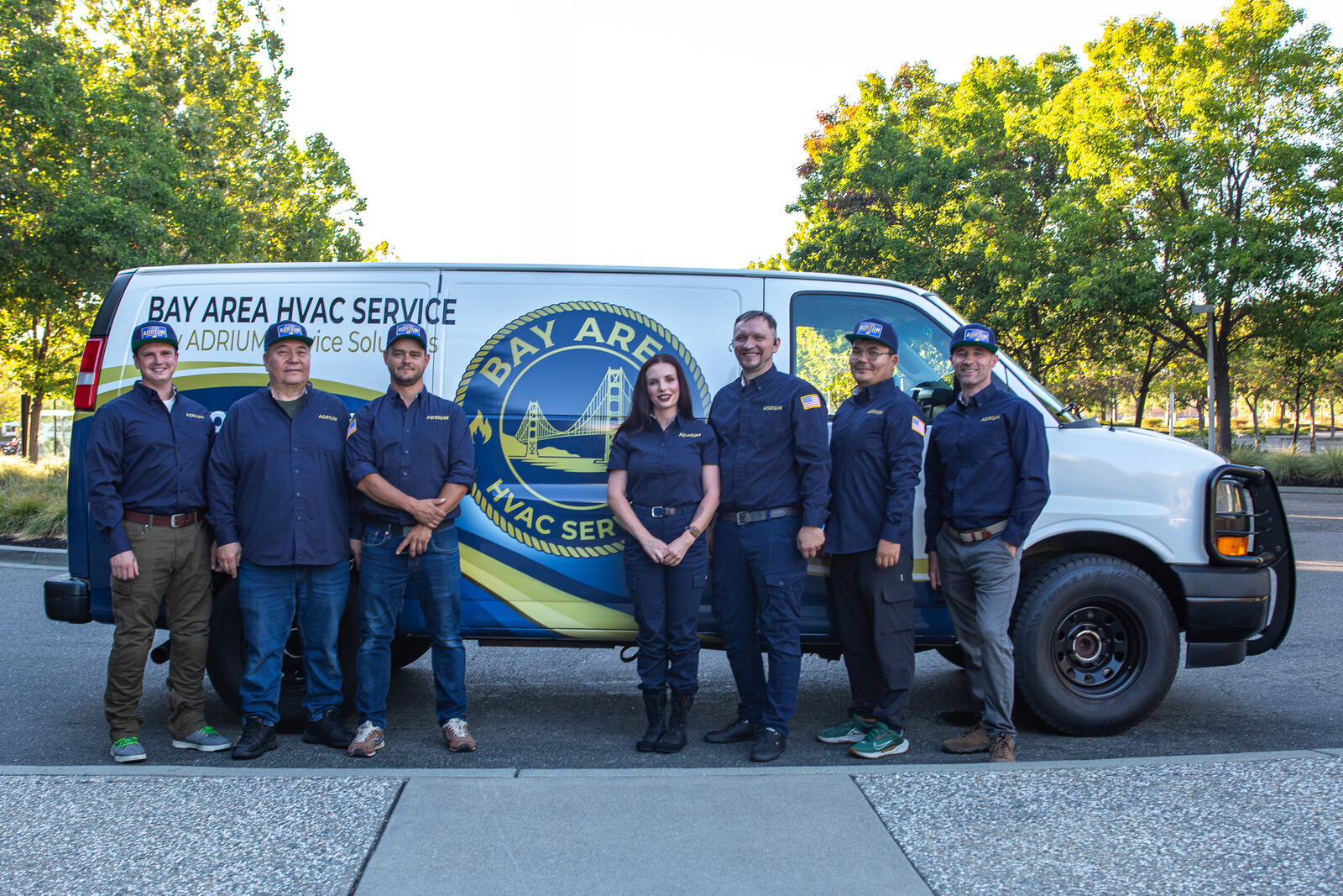 The ADRIUM Service Solutions crew standing with the service van
