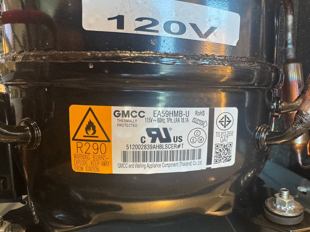 The failed compressor: a GMCC EA59HMB-U on R290 that matched the manufacturer's known bad-batch.