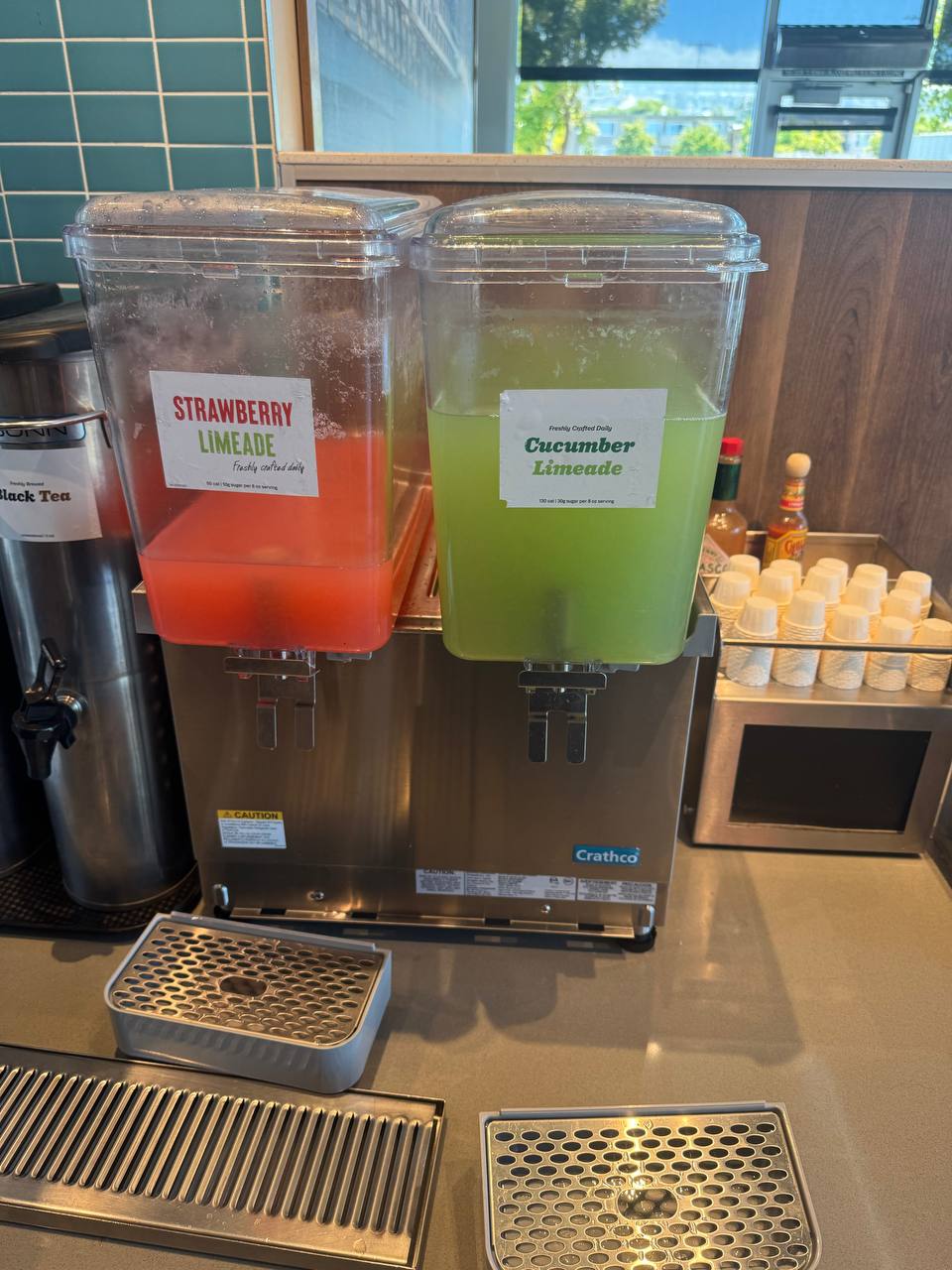Twin-tank Crathco cold beverage dispenser in service, running Strawberry and Cucumber Limeade, at a Millbrae restaurant.